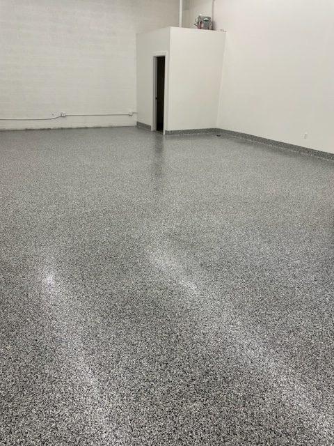Concrete floor with an epoxy coating, showcasing the smooth surface.